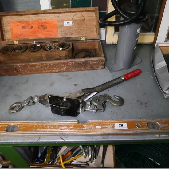 wire strainer and a builder's level