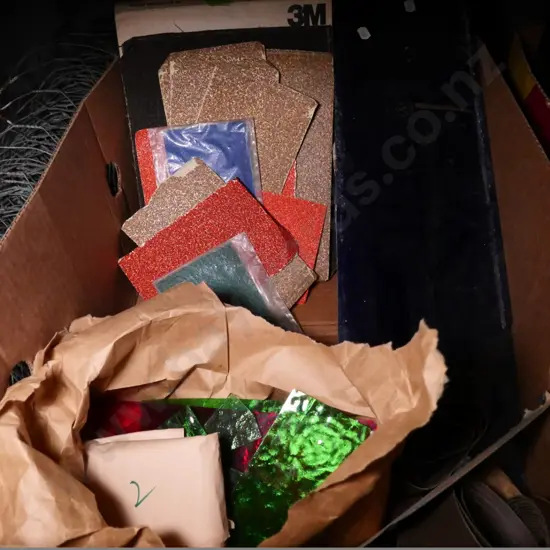 box of assorted pieces of coloured glass