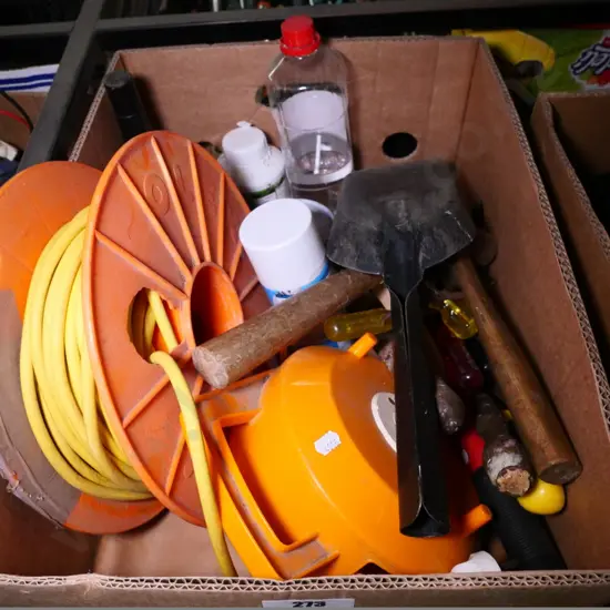 box of hammers, extension cords, hearth brush, etc.