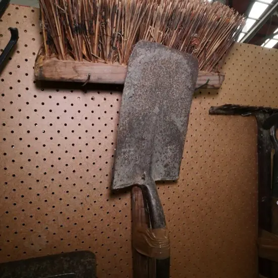 vintage spade and a yard broom