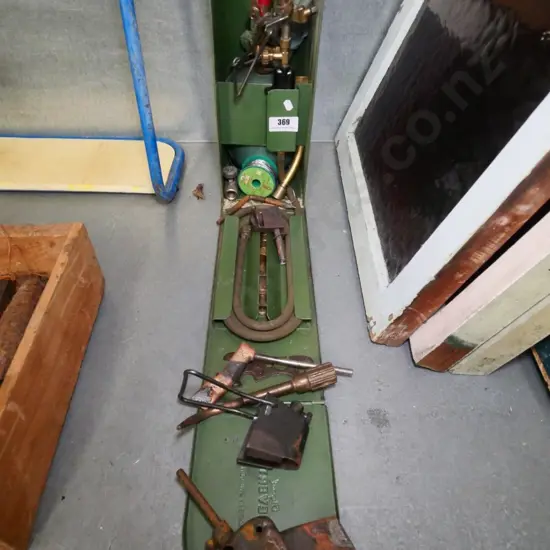 gas torch and accessories in metal case