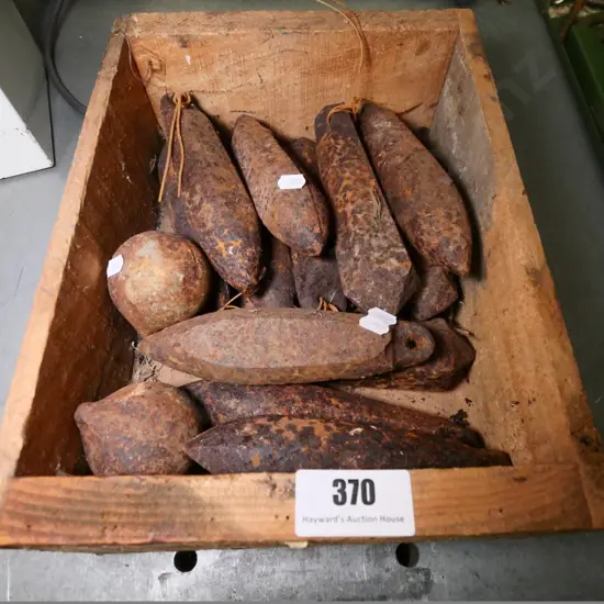 box of rusty window sash weights