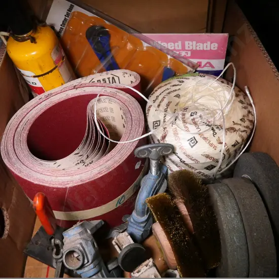 box of allsorts: saw blades, sandpaper, string, etc.