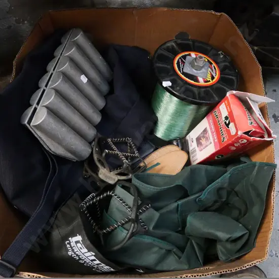 box of fly rod bags, fishing line, camo tape, etc.