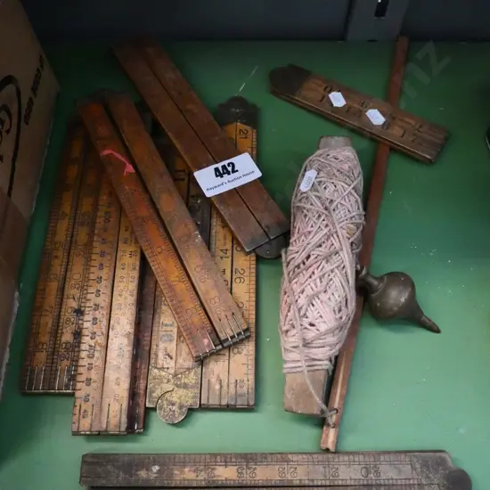 wooden builder's rules and vintage plumb bob