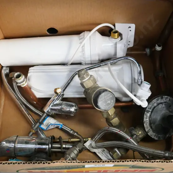 box of water filters, kitchen tap, valves, etc.