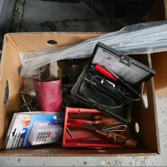 box of drill chucks, battery tester, auger bits, etc.