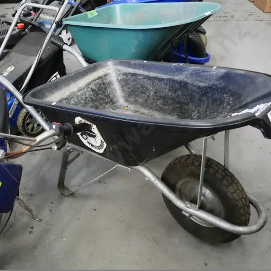 black plastic contractor's wheelbarrow