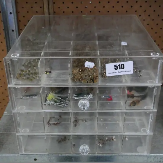 perspex drawers with numerous fishing flies