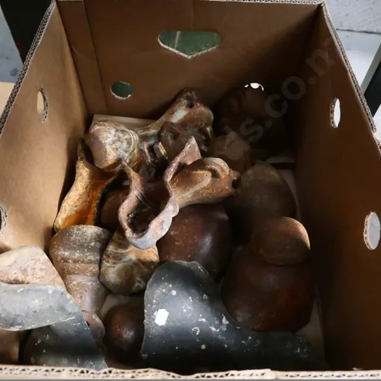 box of mismatched cast iron bath feet