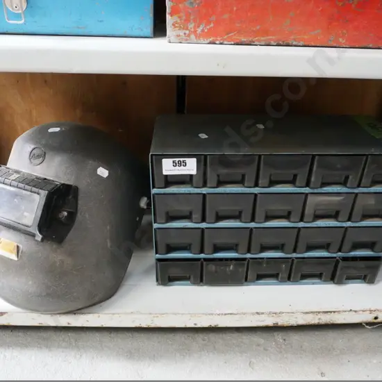 welder's mask and a set of small hardware drawers and contents