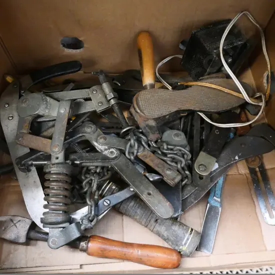 box of plumber's wrenches, valve pullers, hammers, etc.
