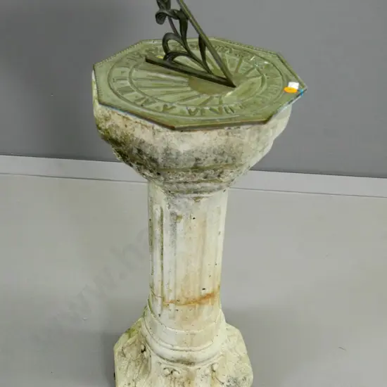cast brass octagonal sundial on carved Oamaru stone column base  - has mend to base H-620 W-250