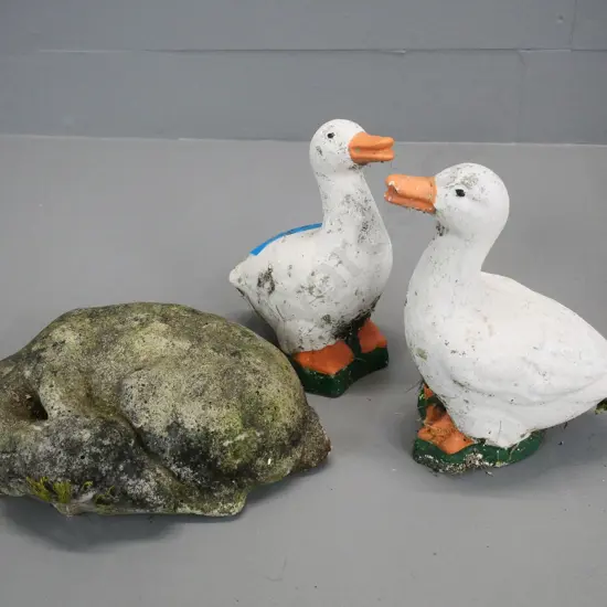 3 small cast concrete garden ornaments - sleeping fawn and 2 painted ducks - some peeling of paint - ducks H-180