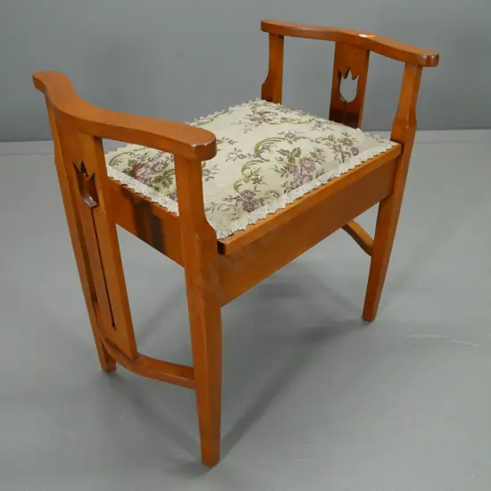 rimu deco style piano stool with tapestry upholstered lift-up lid - some splitting to one side rail H-600 W-620 D-390