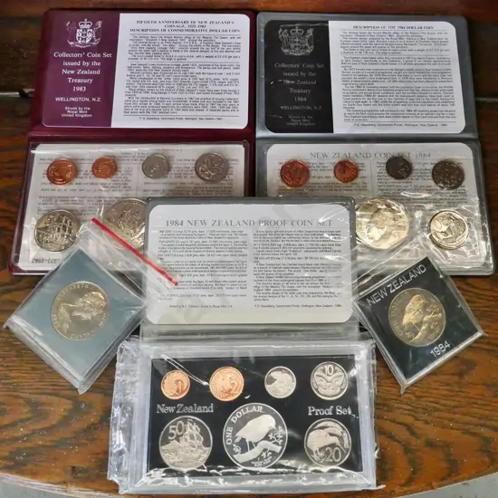 5 New Zealand collector coin items: 1983 collectors set,1984 cased proof set, 1984 collector set, 1983 and 1984 dollars
