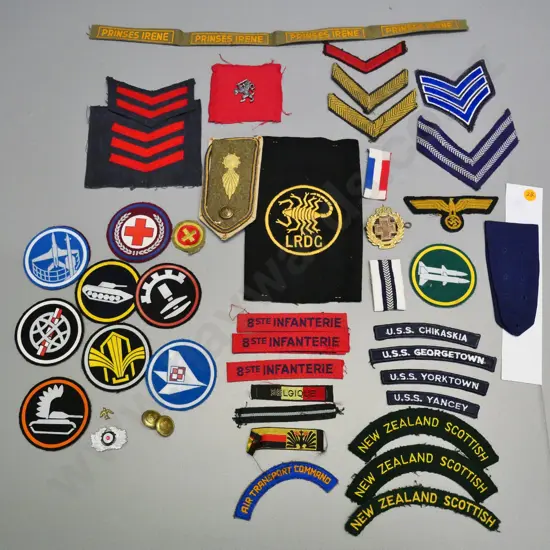 assorted military fabric badges, bars and insignia, buttons etc. plus some first day covers, matchboxes etc.
