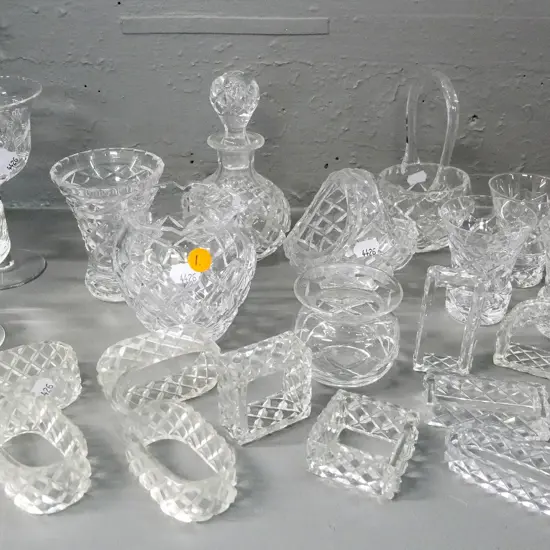 large assortment of crystal items -  3 vases, 2 baskets, 11 napkin rings, sauce bottle etc.