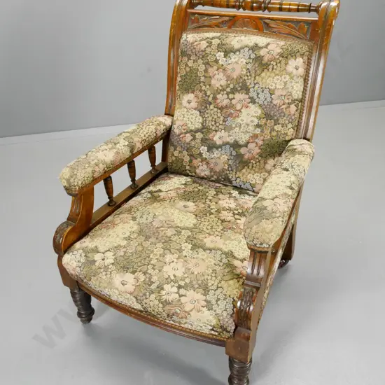 Edwardian armchair w/carved & turned back, spindle sides, porcelain casters, some fading to tapestry H990 W6470 D800