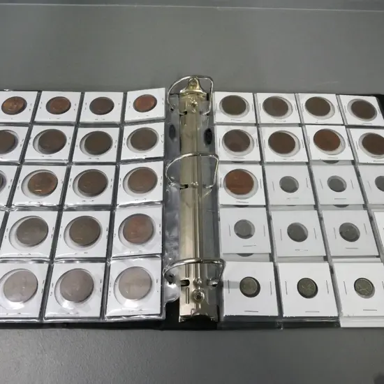 coin collectors album with 5 mostly full sheets of New Zealand pre-decimal coins