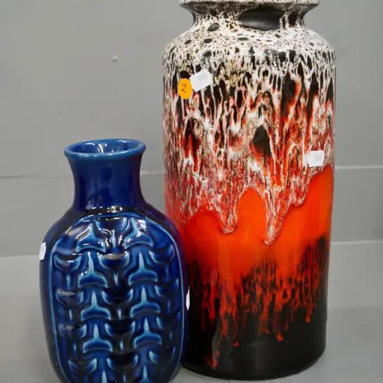 German pottery orange and brown trickle glaze vase H-300 and a raised pattern blue vase