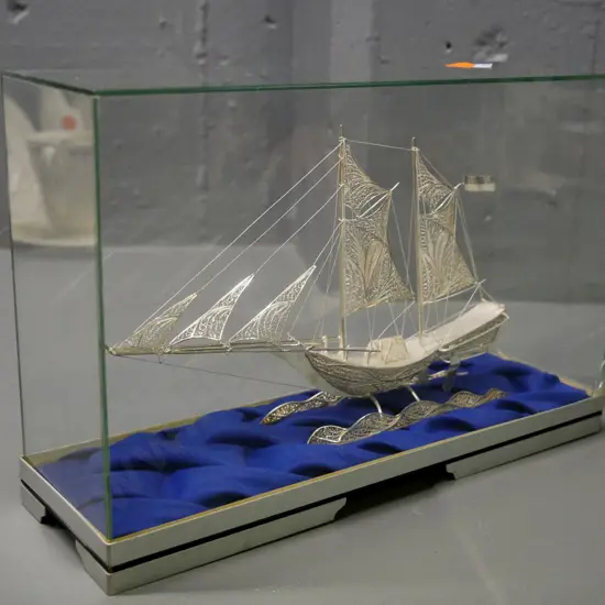 silver filigree sailing ship model in glass, metal and wood display case - cracks to corner of one pane H-170 W-260 D-90