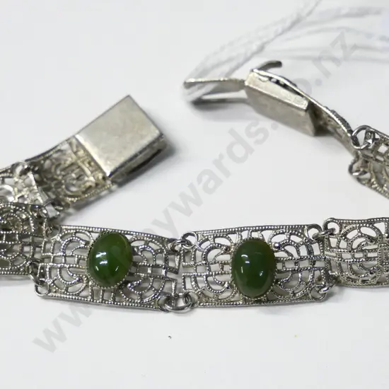 silver costume bracelet with 2 green stones no markings