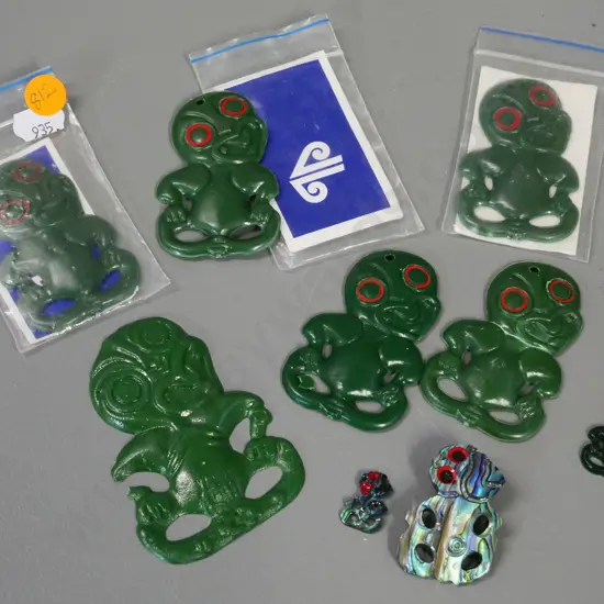 8 small souvenir tikis - two in Air New Zealand packaging, two are paua shell, largest is H-80