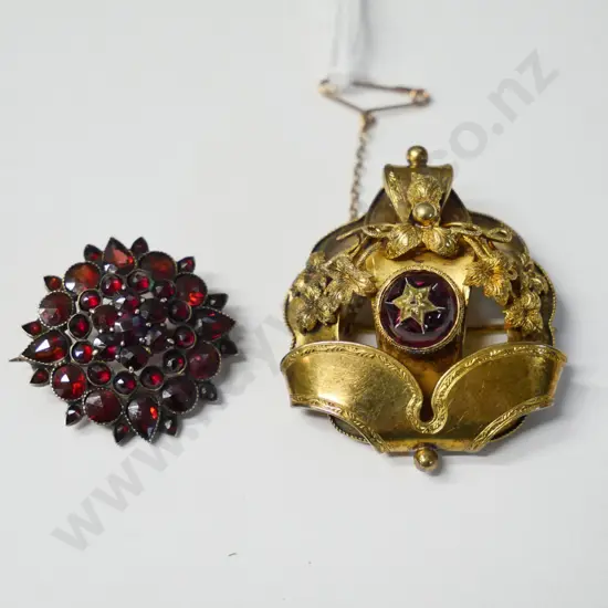 2 brooches - one marked 9 CT with cluster of red stones, the other unmarked