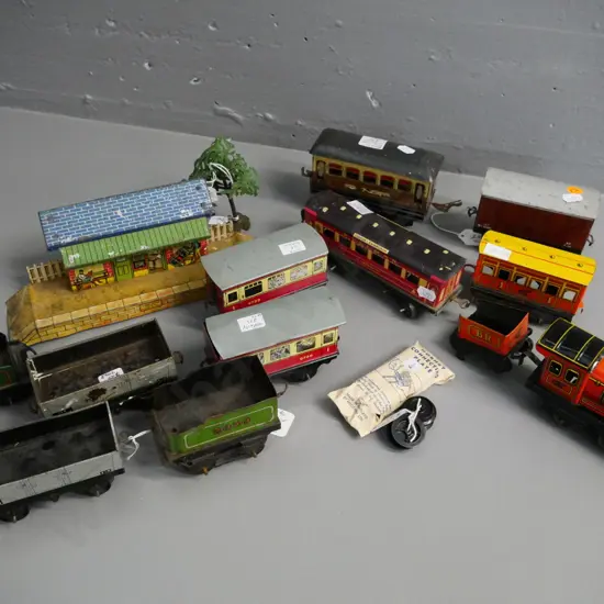 collection of tin Hornby model railway items - one engine, assorted rolling stock, station, spare parts etc/