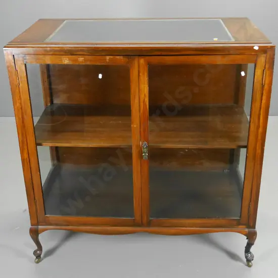 beech cab leg display cabinet on casters with glazed top and sides, lockable, w/ key. Marks to polish. H1102 W1070 D510