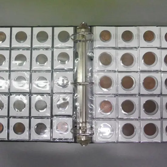 coin collectors album with 5 mostly full sheets of NZ pre-decimal coins