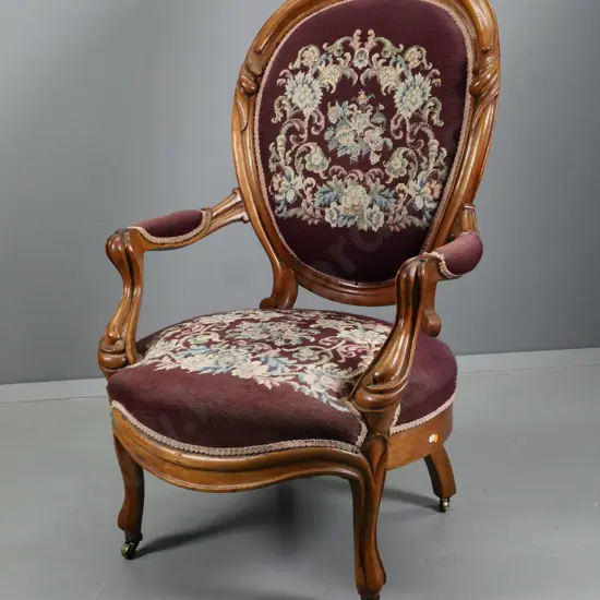 Victorian walnut carved-frame armchair with hand-worked tapestry seat and back, on metal casters H1070 W670 D650