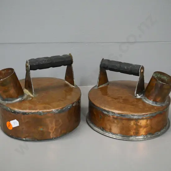 pair of small beaten copper kettles with wooden handles H-130 W-160