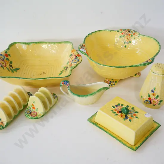 assorted Crown Devon yellow glaze floral items - 2 dishes, 2 toast racks, cover butter dish, caster shaker, sauce boat