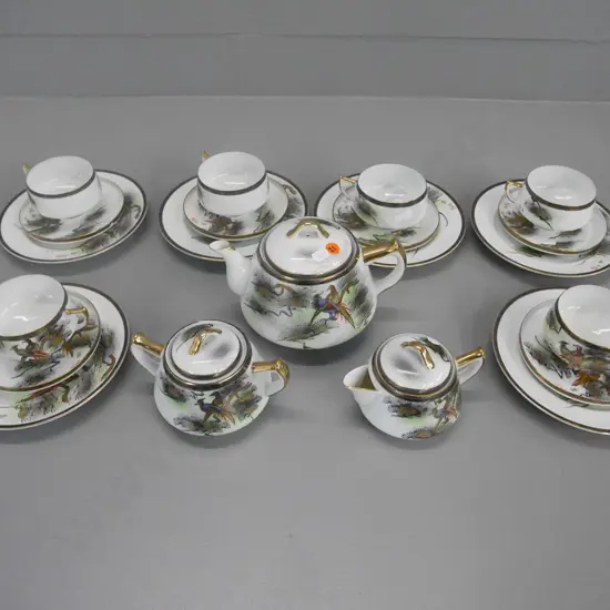 Japanese geisha 21 piece tea set (chip to 1 saucer)