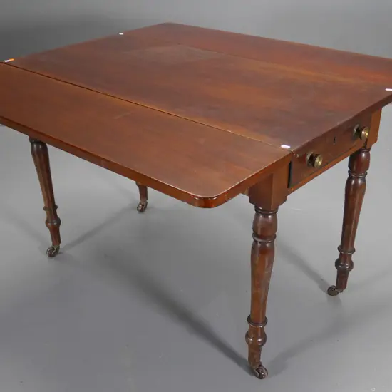 mahogany drop-side supper table w/drawer, turned legs on porcelain casters, some fading/marks H685 W1060 L985 open