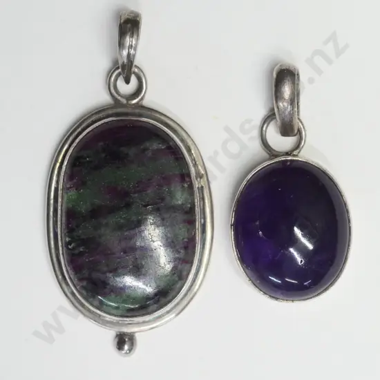 2 silver & stone pendants no marking or chain