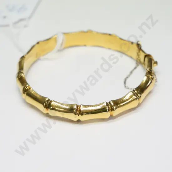 rolled gold bangle with safety chain