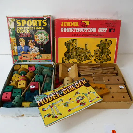 2 boxed wooden child's construction toy sets - one has instruction booklet and mis-matched box lid
