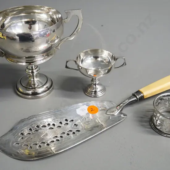 sterling silver bone-handled serving slice, napkin ring and trophy cup H-110, and an unmarked small cup