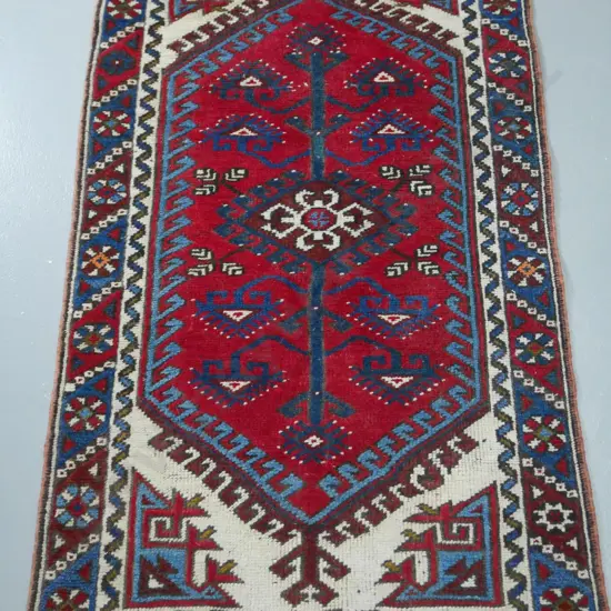 Persian style hand-knotted wool floor rug - dark red, blue and cream L1250 W740
