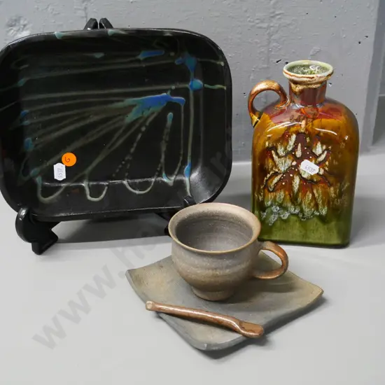 3 studio pottery items - baking dish, handled flask H-180 and a cup & saucer with spoon