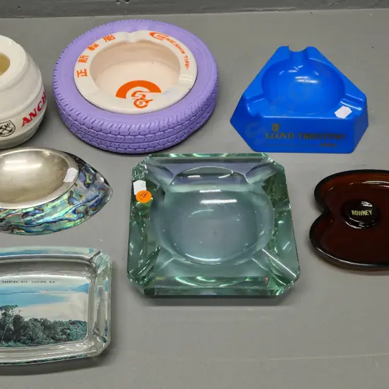 7 assorted advertising and souvenir ashtrays including paua, Tautuku Bay Catlins, etc.