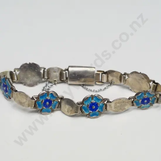 silver bracelet with safety chain stamped with S.R. anchor, lion & W