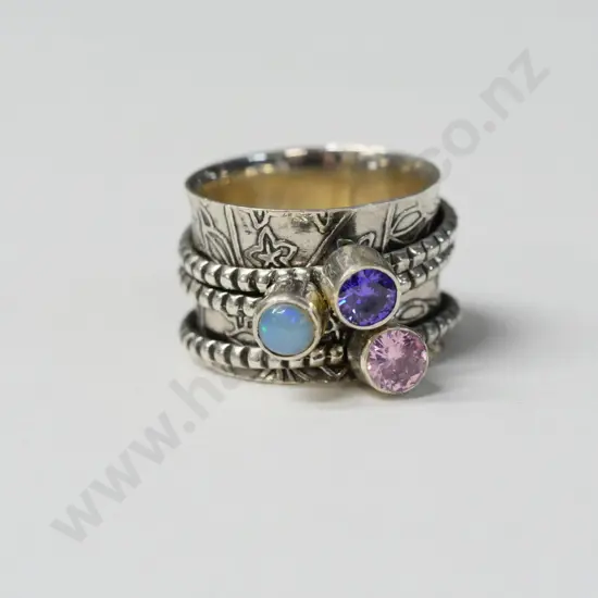 silver ring with 3 rings with opal, amethsyt & pink stones stamped 925