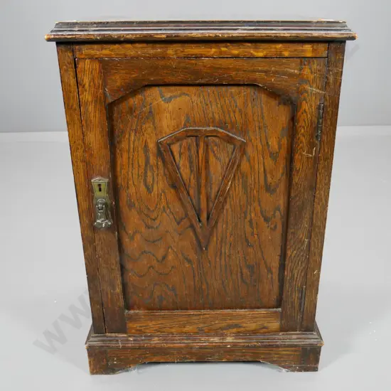 deco oak pot cupboard with brass drop handle, carved detail on door H-590 W-400 D-350