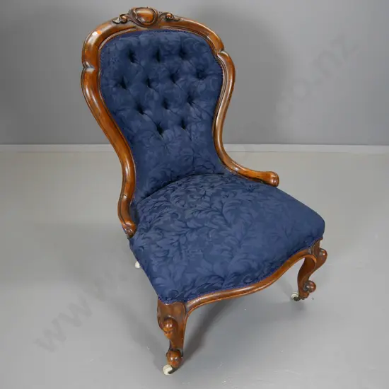 Victorian walnut carved back lounge chair w/deep-button back, blue damask, porcelain casters H930 W600 D650