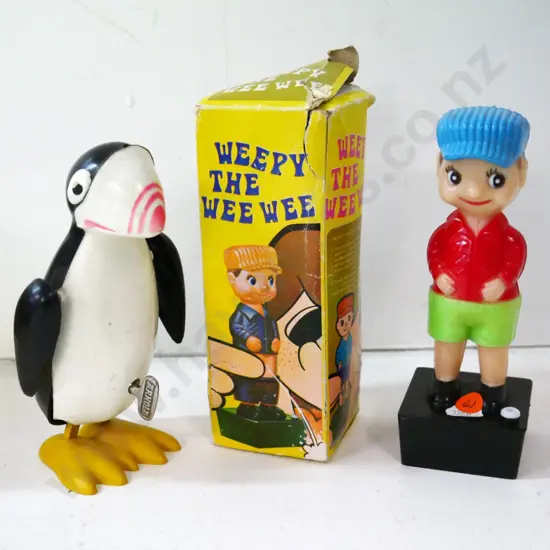 plastic Weepy The Wee-Wee novelty figure (box in poor condition) and a wind-up plastic penguin in going order