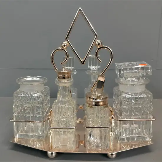glass 6 piece condiment set in plated stand - lid missing from 1 pickle jar H-290 W-290